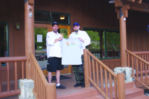 Kim Cameron and her husband Paul (at left) will officially turn over ownership of the Bugaboo Café on July 1 to their friend and former employee, Geoff Calef. PHOTO BY JACOB OSBORNE