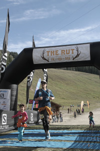 Ten hours and 50 minutes after he began The Rut, Scott Hoeksema crosses the finish line with his oldest daughter, Lily.