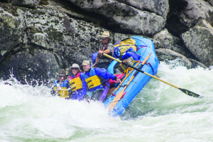 Guide Joe Lindsay drops his raft into a big trough in “Jim’s Creek” rapid.