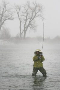 The thrill of fighting a fish is amplified in winter, when you’re also fighting the elements. 