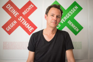 Jonas Frykman poses for a photo in the Aktionsbündnis Brandenburg. Frykman’s organization is devoted to combatting racism in Germany and often advises journalists how to depict members of the right wing. PHOTO BY KIRA VERCRUYSSEN 