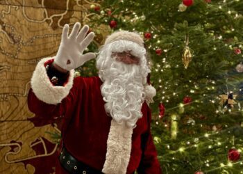 Santa Claus poses for a photo at BASE Community Center during the 27th annual Big Sky Christmas Stroll in Town Center on Saturday, Dec. 14. PHOTO BY AVI LAPCHICK